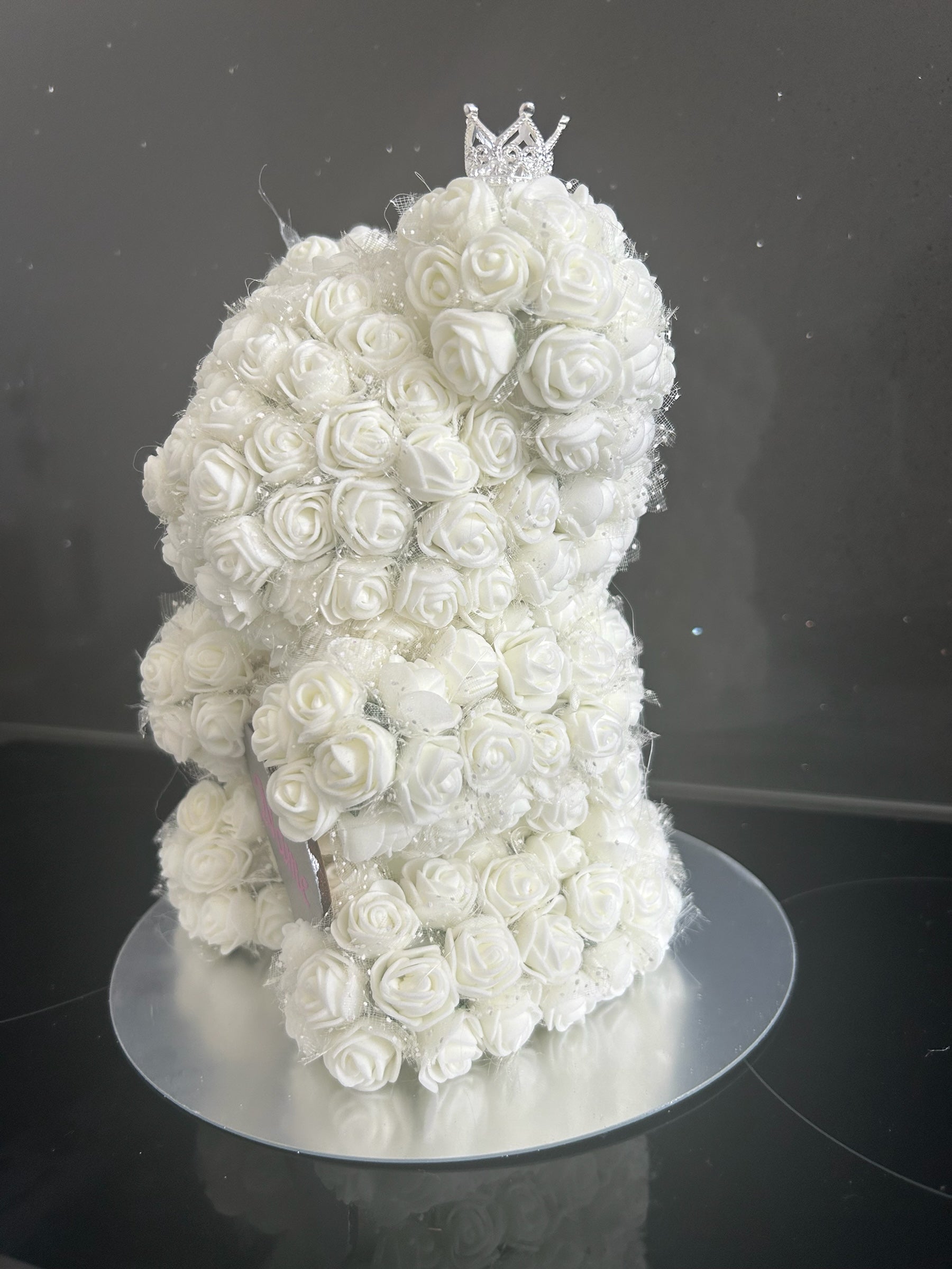 Hartes Handmade white rose teddy bear featuring foam roses, a sparkling crown, and a personalised heart plaque.
