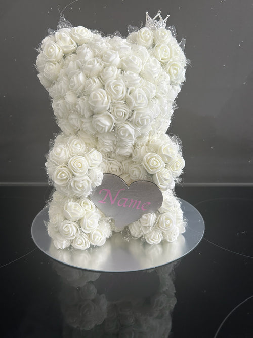 Hartes Handmade white foam rose teddy bear with a sparkling crown and personalised heart plaque on a silver base.